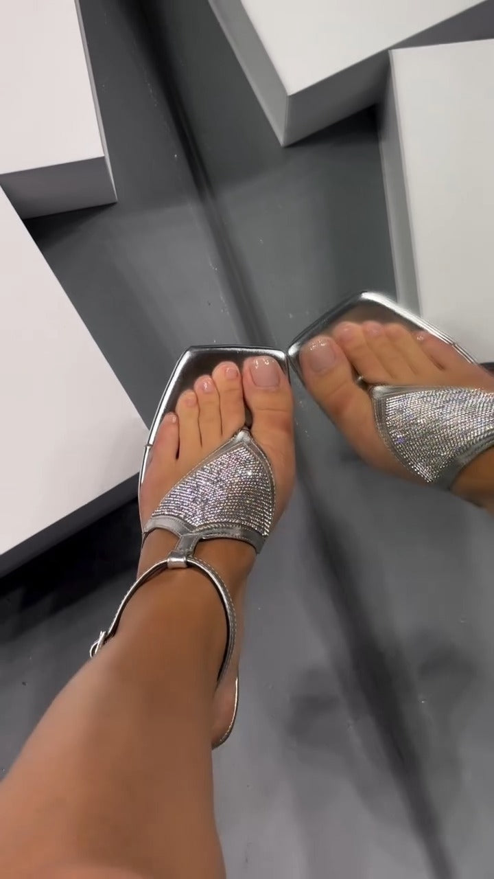 Elegant silver-colored diamond-encrusted high heels